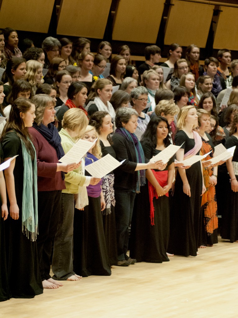 Members of the Women’s World Music Choir invite female friends and relatives to join them for a song during the college’s annual Earthtones spring concert. (Photo by Hannah Bartel)