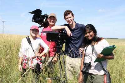 Four people and video equipment