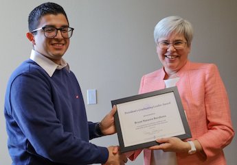 Bryan Nateren presented with award from President Stoltzfus