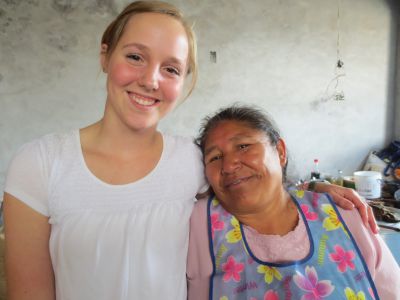 Mary and Olmorato shop for the day's ingredients and prepare a healthy meal for 60 children