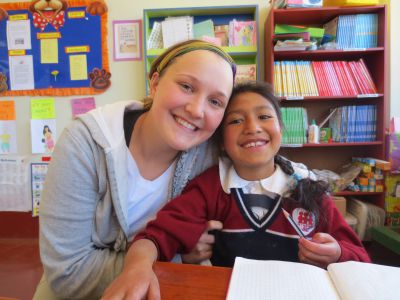 Megan begins her day assisting Katy, a special-needs child, with her assignments