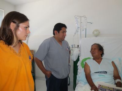 Examining a patient who suffered a stroke while working on his farm