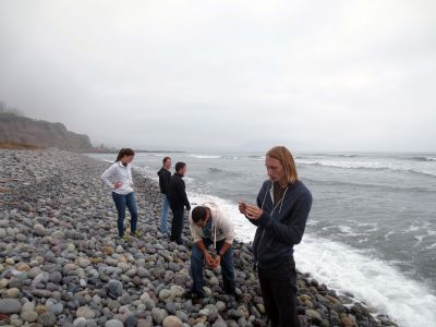 Students enjoy a visit to the Pacific Ocean. Most dipped their hands in the chilly waves.