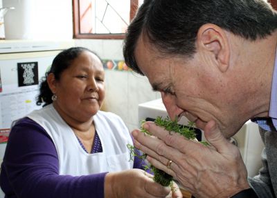 Goshen College Director of International Education Tom Meyers inhales the fragrance of an Andean herb.