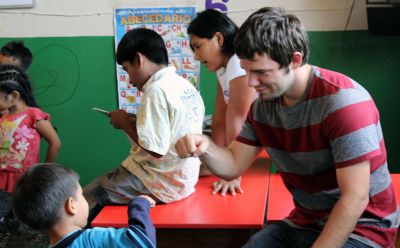 Affirmation: Joshua uses a fist bump to congratulate a child.