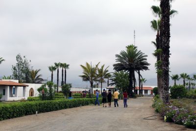 Students walk back to their bungalow at Kawai, a Christian vacation campground on the beach south of Lima.