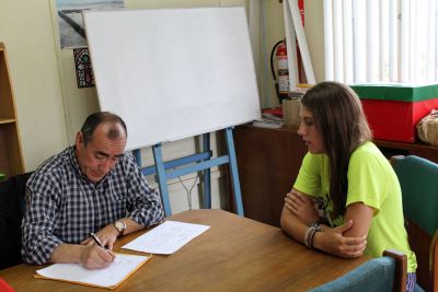 Lauren takes her oral examination with her Spanish teacher, Moises Arce Zavala.