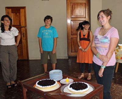 Malaina is the uncomfortable center of attention as her birthday is celebrated.