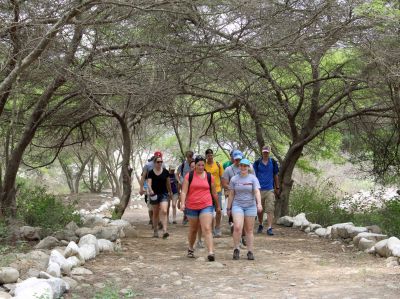 Students walk on a lovely trail to Caral.