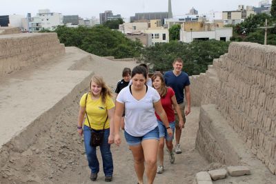 Students climb a pyramid.