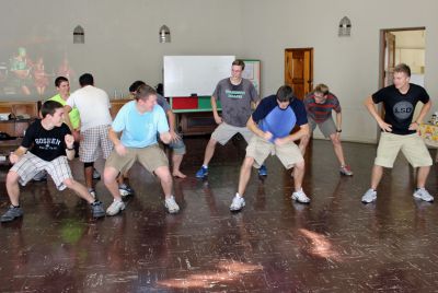 The men show their enthusiasm for dancing.