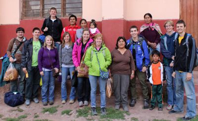 Goshen College students gather with their host family members in Lucre, an Andean community near Cusco.