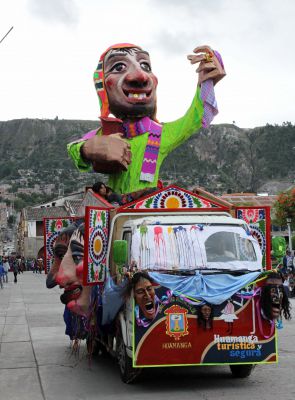 The Ño Carnavalon, a large effigy said to represent the spirit of the carnival, is driven through the Plaza de Armas.