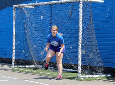 Aimee moves into position to prevent a goal from being scored.