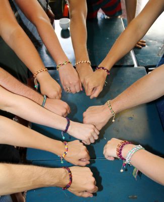 Students show off their new bracelets.