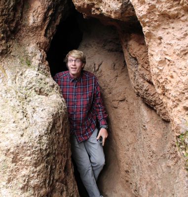 Jackson emerges from a cave.