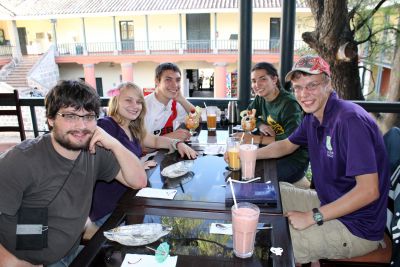 Jonathan, Aimee, Jake, Gretchen and Thomas enjoy drinks and dessert in an Ayacucho cafe and restaurant.