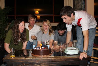 April, Derek, Aimee, Jonathan and Jake blow out the candles on their birthday cake.