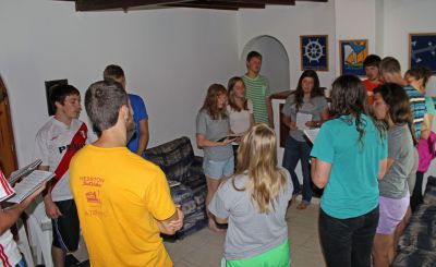 Students sing a hymn during the Sunday worship service.