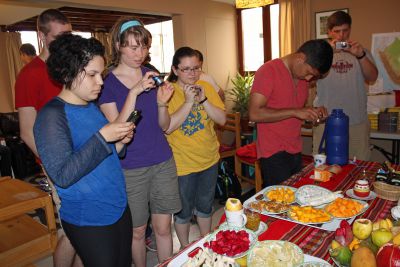 Edith, Leah, Miranda, Alejandro and Michael take photos of Peruvian fruit.