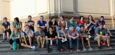 Students wait for a bus outside the Cathedral of Lima.