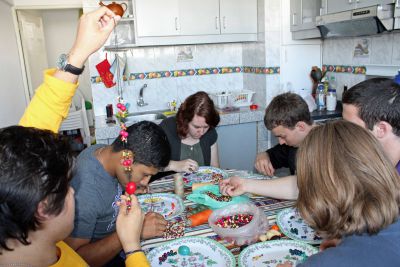 The necklace group gathered around the kitchen table