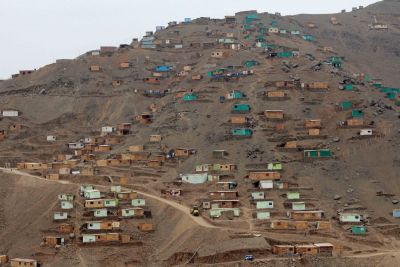 A sprawling new neighborhood on a rocky hillside in Puente Piedra. These small homes lack running water, gas and electricity.