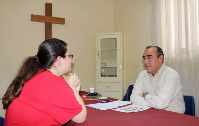 Miranda takes her Spanish oral evaluation with her teacher, Moises Arce.