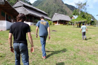 Lucas and Joel and Kimo Director Henry Viguria walk toward the camp.
