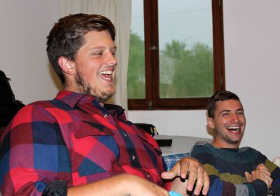 Michael, left, laughs about a health problem during his time on service. Stefan finds the story to be hilarious.