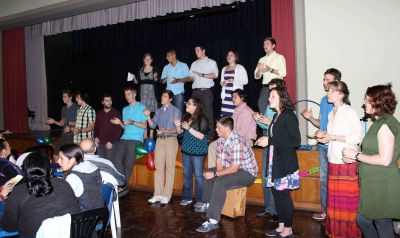 Students sing a song of welcome to their host families.