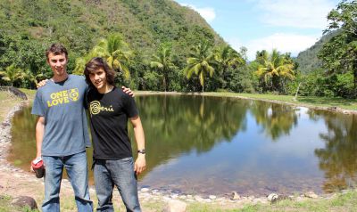 Joel and Lucas beside a pond at the Kimo camp.