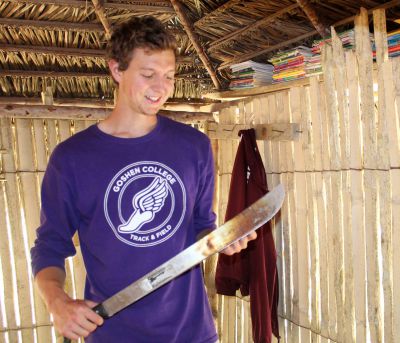 Derek shows the machete he purchased to help with chores on his family's farm.