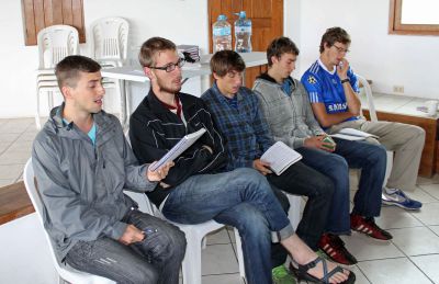 Stefan, Matt, Tim, Joel and Derek William sing during worship.