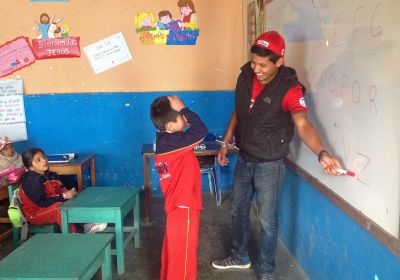 Alejandro makes a connection with a student.