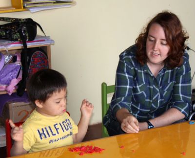 Sierra helps a student.