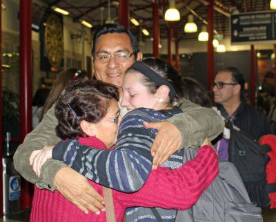 Jaime hugs her host parents.