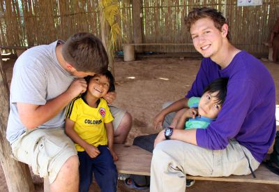 Michael and Derek give two boys some loving attention.