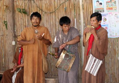 Musicians play for village guests.