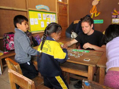 Max plays a memory game with students at San Martin, a public school that serves deaf children in Cusco.