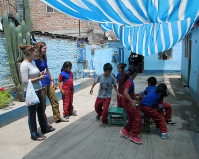 Playing an educational game of musical chairs at William Thomson school.