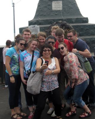 Celia takes a selfie with the students near the cross at Cerro San Cristóbal.