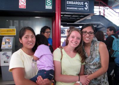 Courtney's host family says goodbye as she leaves, via bus, for her service location.