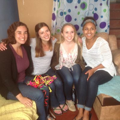 Abbie, Morgan, Kate and Asia pose for a photo in Morgan's living room.