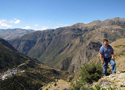 Willy poses above his home town of Vito.