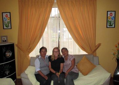 Anna with her host mother and sister (and two paintings given as gifts).