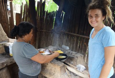 Katie in the kitchen with her host mother.