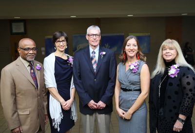 (L-R) Aliko Songolo '68, Alice Gunden Bender '80, Ken Pletcher '70, Sonia Graber '00, and Kathy Short '75. 