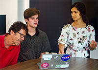 Paul, Samuel, Lisa examine a map