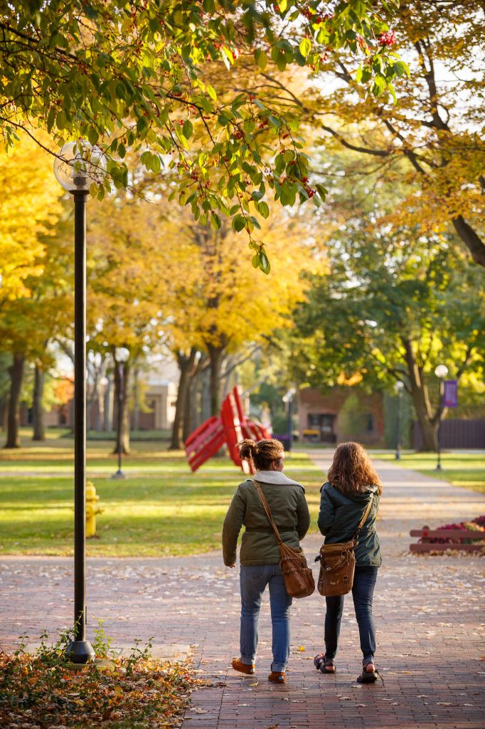 Two students walking on Goshen's college campus